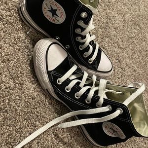Woman’s converse high tops